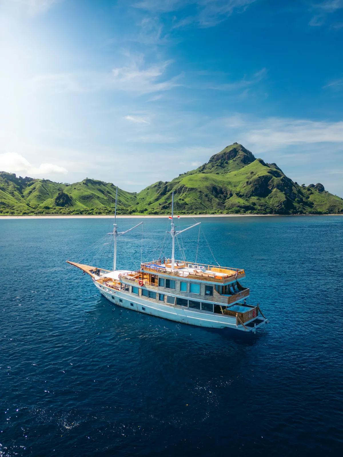 A large boat floating on top of a large body of water